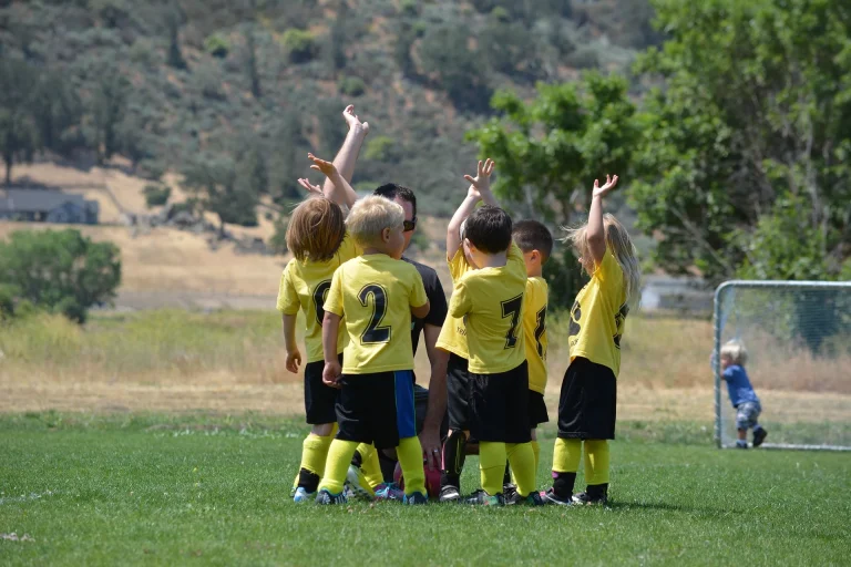 Team of young people on soccer field