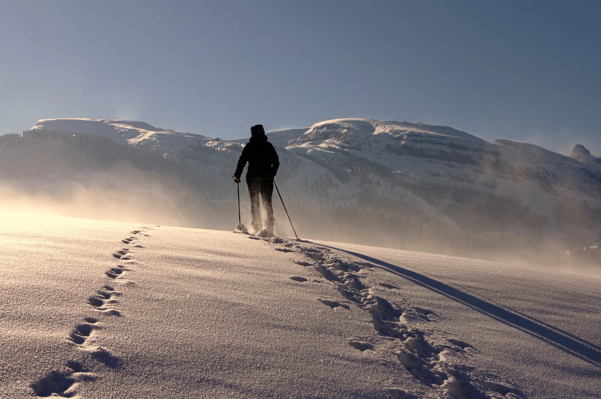 Person walking in the snow leaving tracks