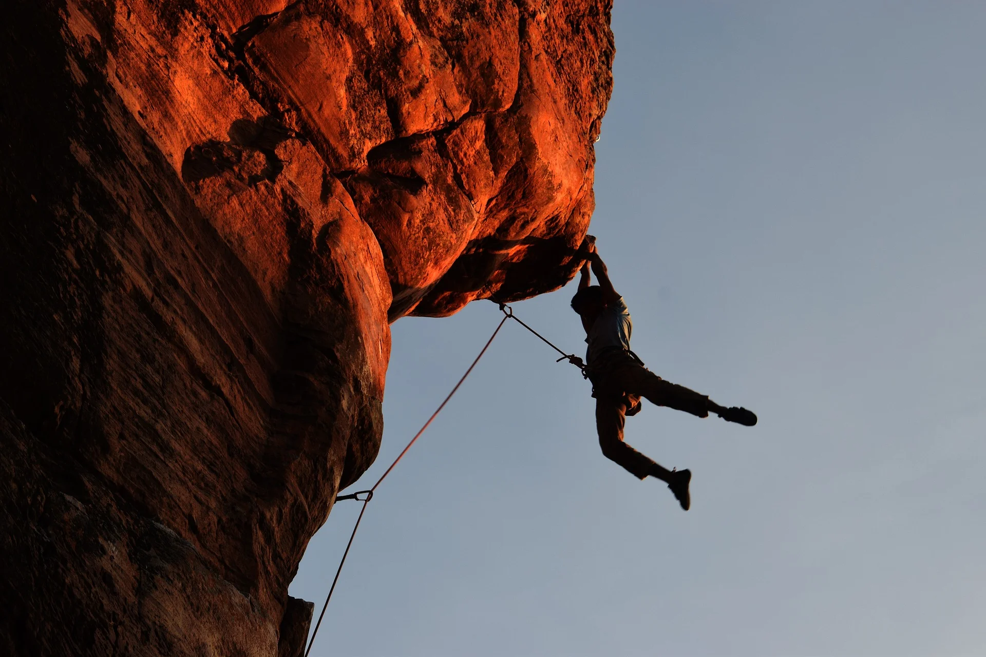 Person hanging off rock face