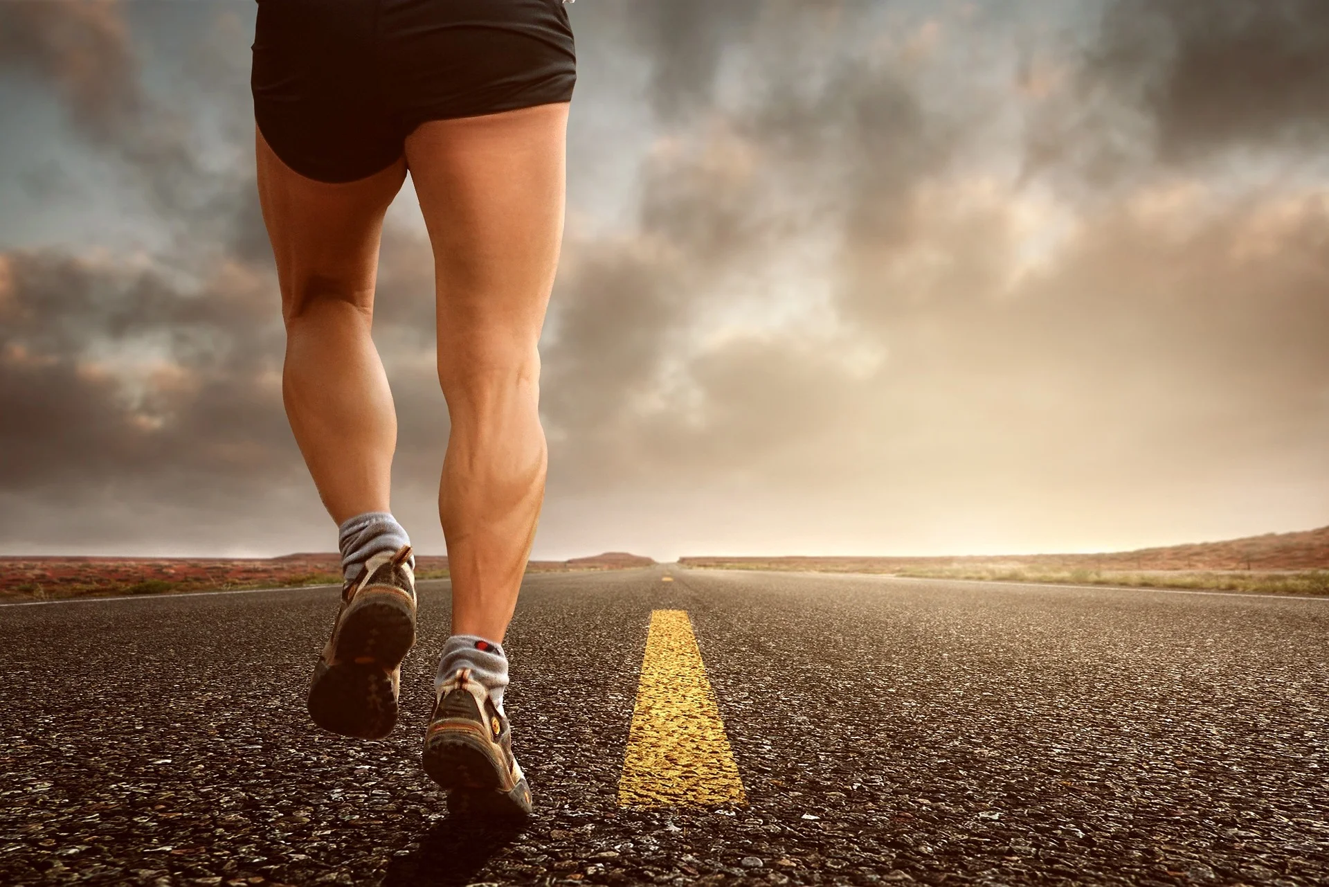 Man running on empty road