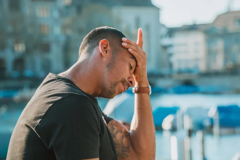 Man with headache and hand on head