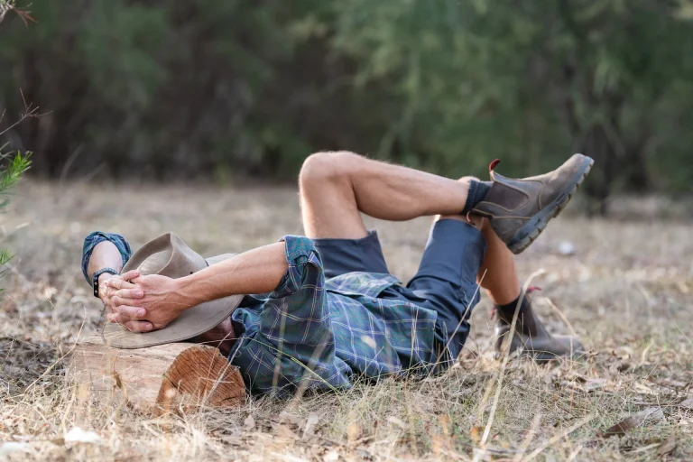 Man laying in field thinking