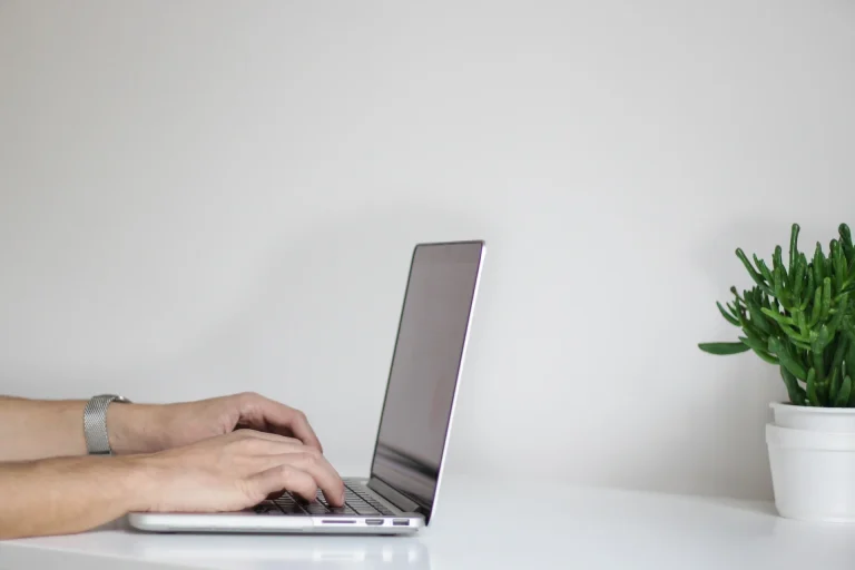 Person typing on laptop