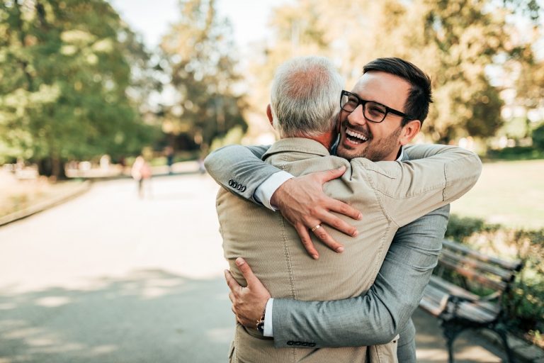 Man hugging his father