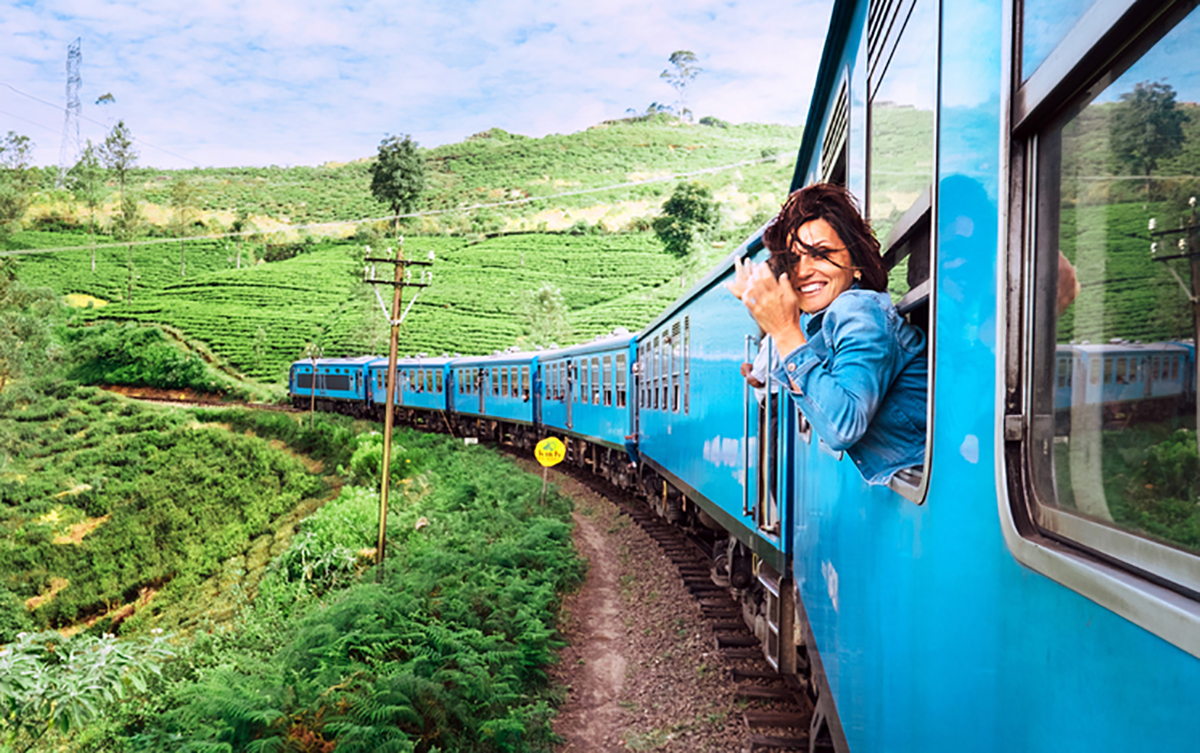 Woman hanging out of train window