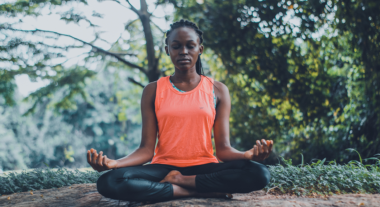 Woman practicing yoga in nature