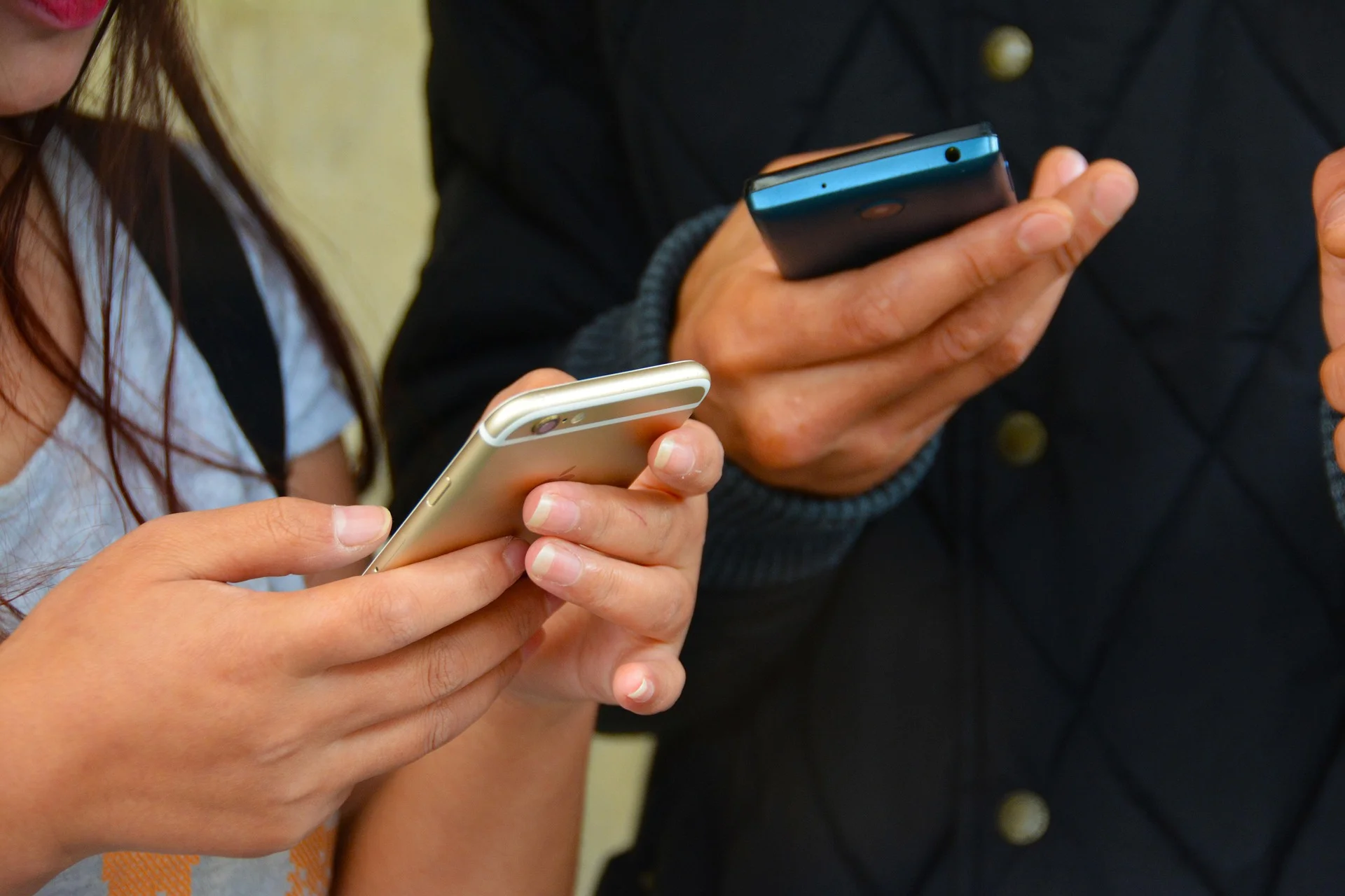 People holding mobile phones